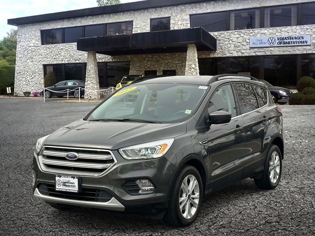 Used 2017 Ford Escape SE with VIN 1FMCU0GD8HUC16799 for sale in Saint James, NY